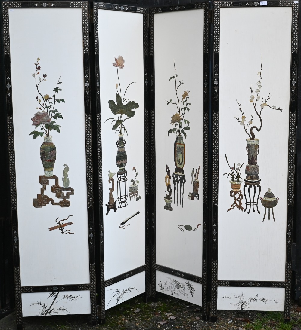 An early 20th century Chinese four-panel folding dress screen, the front with white lacquered panels