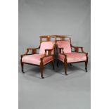 Two companion Edwardian Sheraton Revival style satinwood inlaid rosewood salon armchairs, with