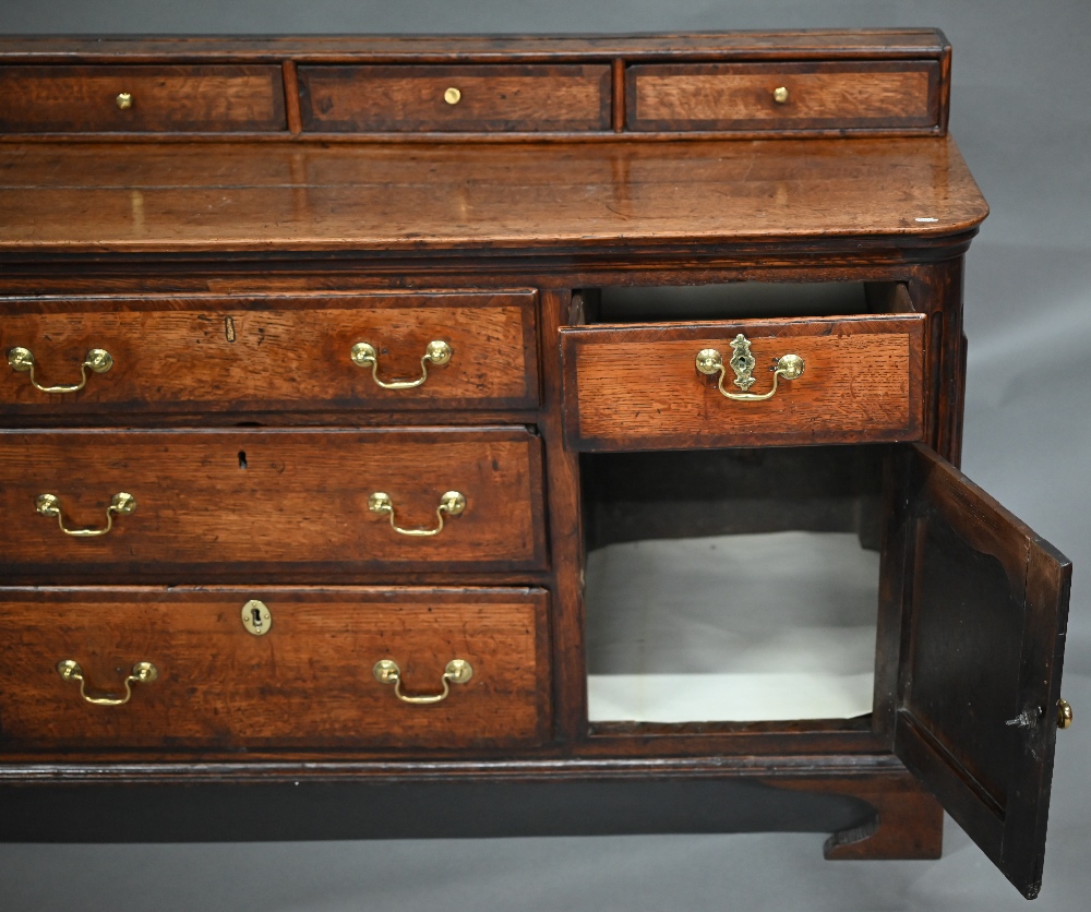 A 18th century oak low dresser, the two plank top with four drawer stage back, over an arrangement - Image 3 of 4