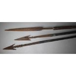 Four tribal spears with iron heads to/w an arrow (5)