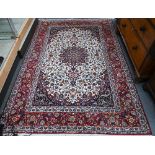 A fine contemporary Persian Tabriz rug, the cream ground with floral design medallion rambling