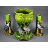 Bretby majolica jardinère with moulded leaf design, the base mounted with two cranes, 40 cm high, no