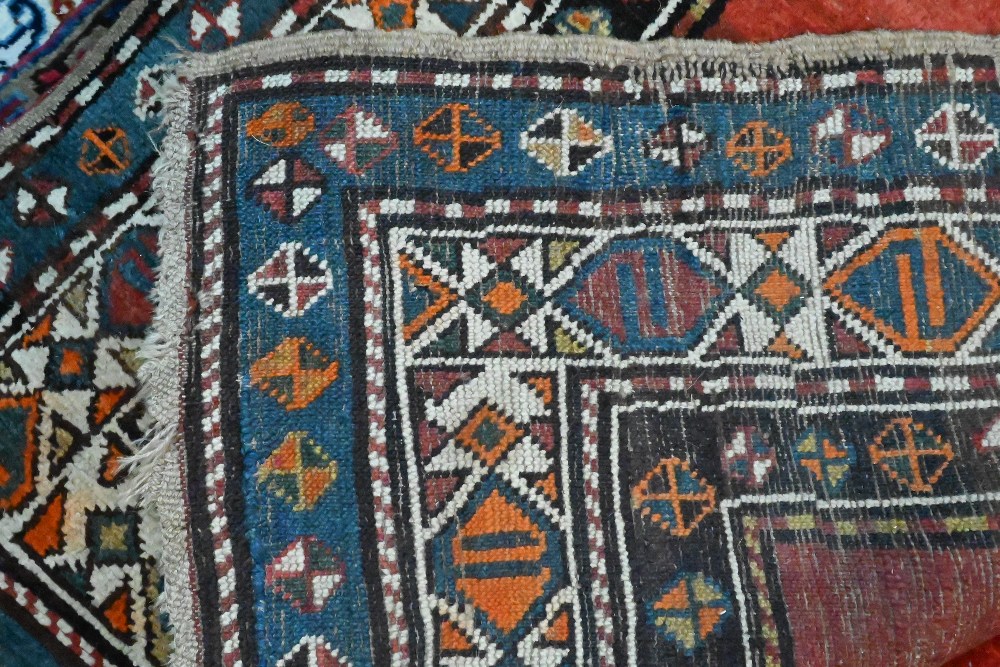 An antique Persian Hamadan rust-red ground runner, the stylised boteh within multi-coloured borders, - Image 3 of 3