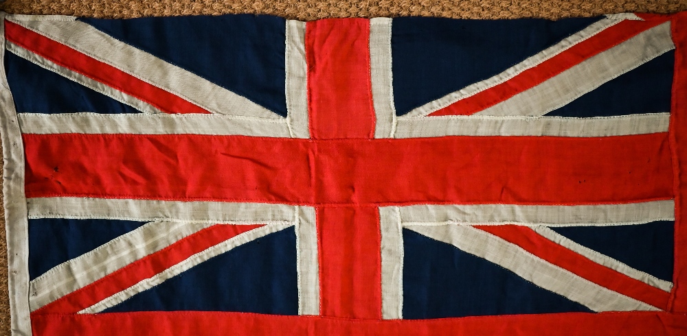 A WWII period Royal Navy ensign, of stitched panels with 'union jack' to top corner, stencilled 'C - Image 2 of 5