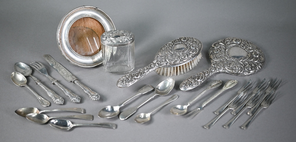 Foliate-embossed silver brush and hand-mirror, Birmingham 1980, to/w a somewhat similar silver-