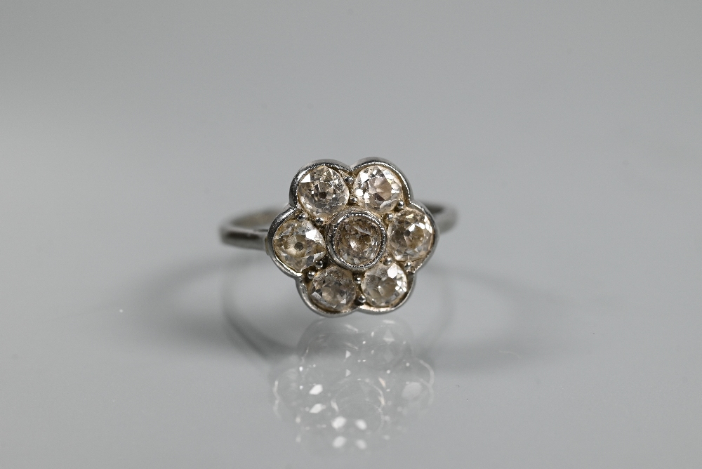 An antique diamond daisy cluster ring, the millgrain set central old cut diamond surrounded by six - Image 2 of 4