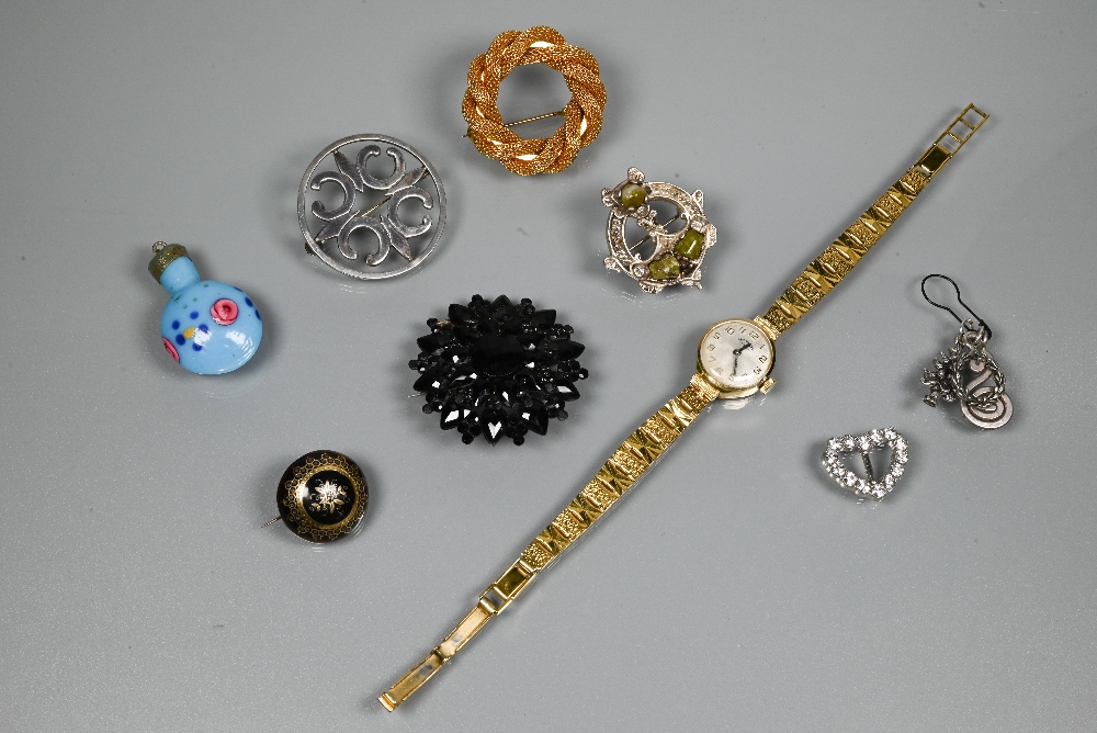 A small collection of jewellery items including a jet mourning brooch stamped Acker, a Victorian