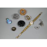 A small collection of jewellery items including a jet mourning brooch stamped Acker, a Victorian