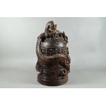 A 20th century Japanese hardwood bell, a replica of a Dotaki (richly decorated bronze ritual