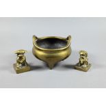 A 19th century Chinese bronze incense burner or censer of typical tripod form with compressed