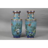 A pair of 19th century Chinese cloisonne on brass rouleau vases decorated in polychrome enamels with