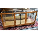 A pair of 1930's oak framed glazed retailers display counters, with three doors to verso, no