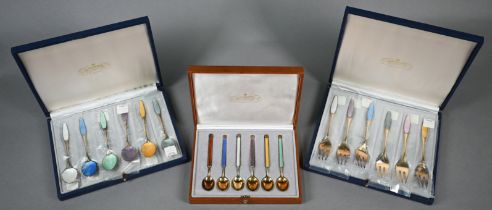 Cased set of six Anton Michelsen (Copenhagen) silver gilt coffee spoons with Harlequin enamel