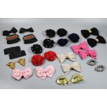 A collection of 1980s shoe buckles/decorations including paste set, ribbon bows, frogs, rosettes etc