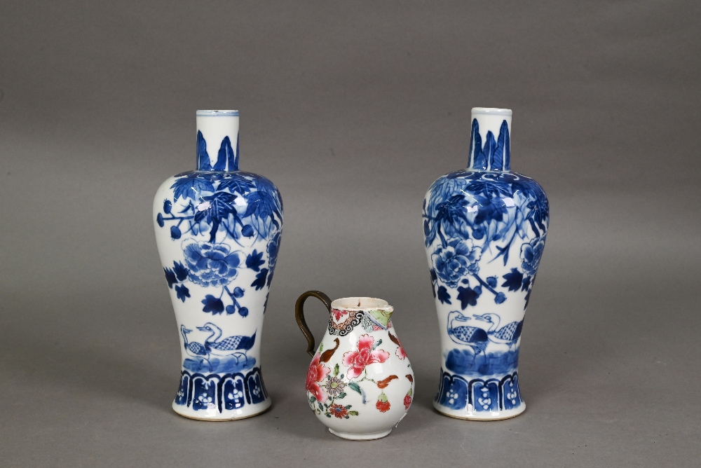 A pair of late 19th century Chinese blue and white baluster vases, late Qing dynasty, painted with