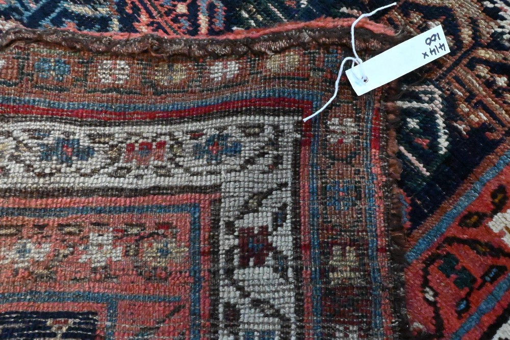 An antique Persian Kurd runner, the ink blue ground with repeating rows of stylised boteh, 417 cm  x - Image 3 of 3