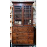 A Regency mahogany secrétaire library bookcase, the associated two door astragal glazed cabinet