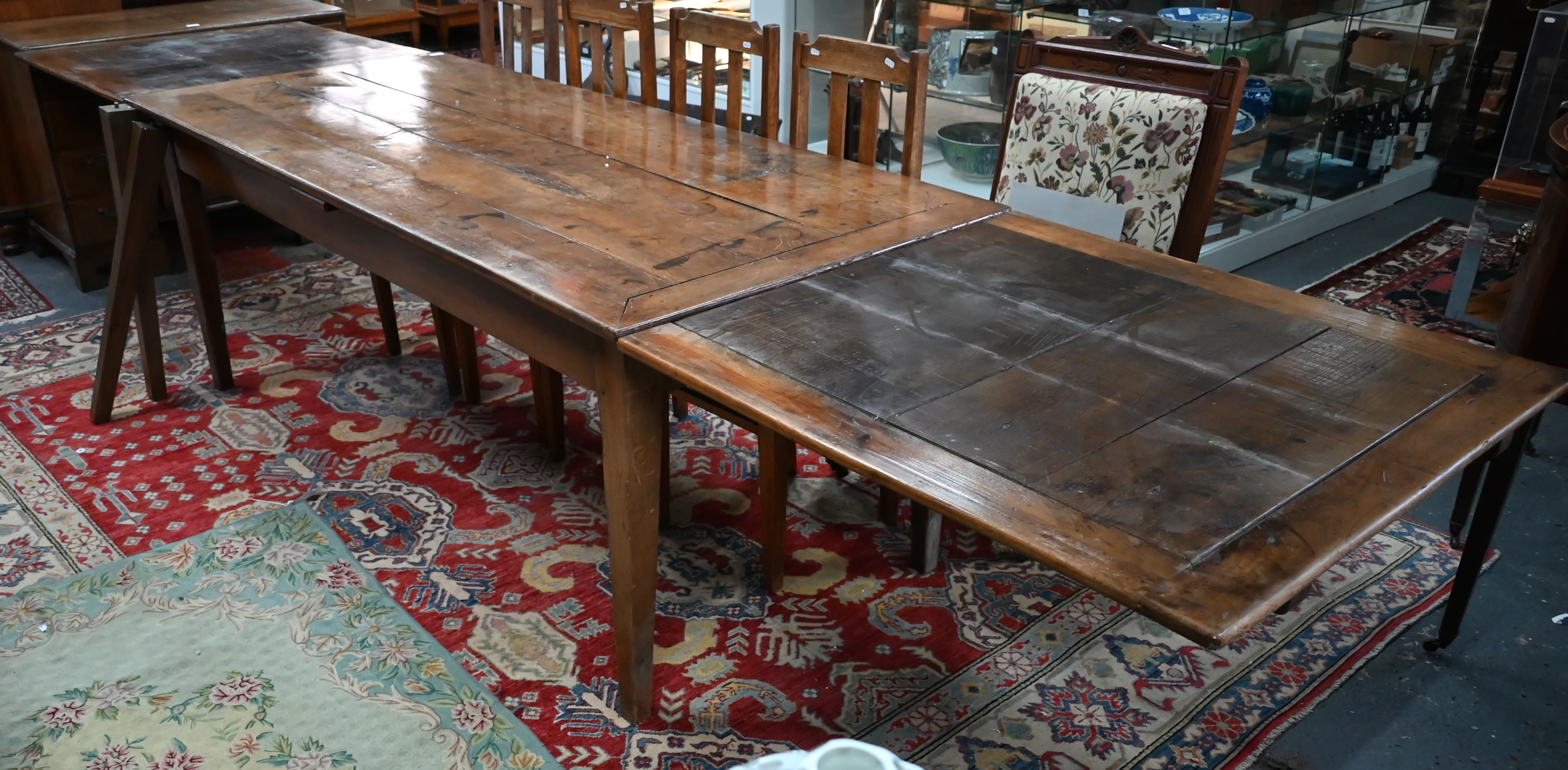 An antique French fruitwood extending draw leaf dining table, with frieze drawer to one end, - Image 14 of 15
