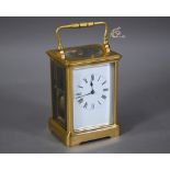 A French lacquered brass 8-day twin drum hour repeat carriage clock, with white enamelled roman