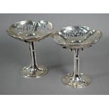 Pair of silver comports with pierced quatrefoil top raised on Art Nouveau organic four-pillar stem