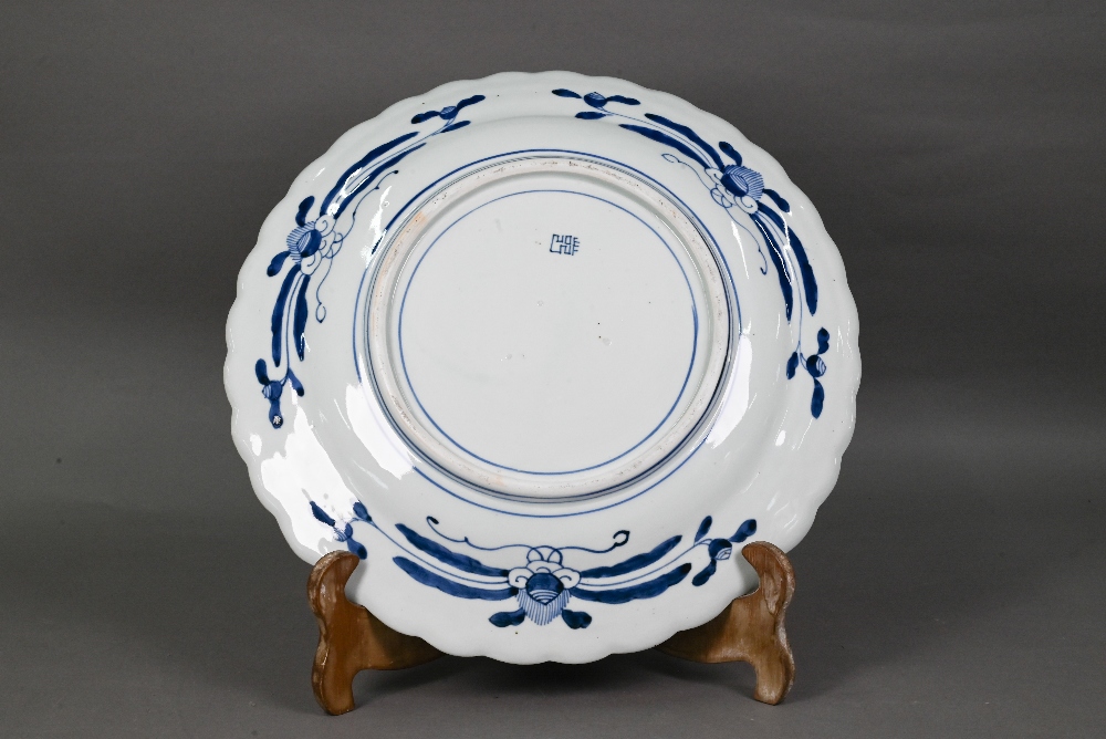 A 19th century Japanese blue and white floriform charger, painted with a goose and bamboo within a - Image 6 of 10
