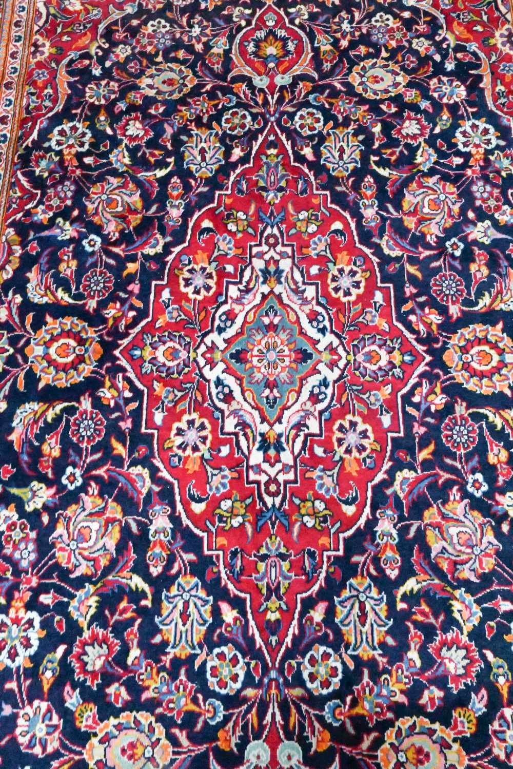 A contemporary central Persian Kashan carpet, the blue and red ground centred by a floral medallion, - Image 2 of 4