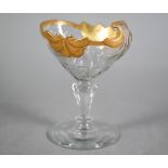 An 18th century Bohemian sweetmeat dish, the half-fluted scalloped bowl with cut and gilded rim,