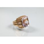 A 9ct yellow gold ring set large rectangular quartz, in high cage-style setting with open ribbed