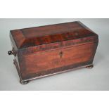A Regency rosewood cross-banded satinwood tea caddy, of sarcophagus form, the interior with twin