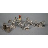 Three miniature silver chickens - one with enamelled head - to/w a white metal example (mark not