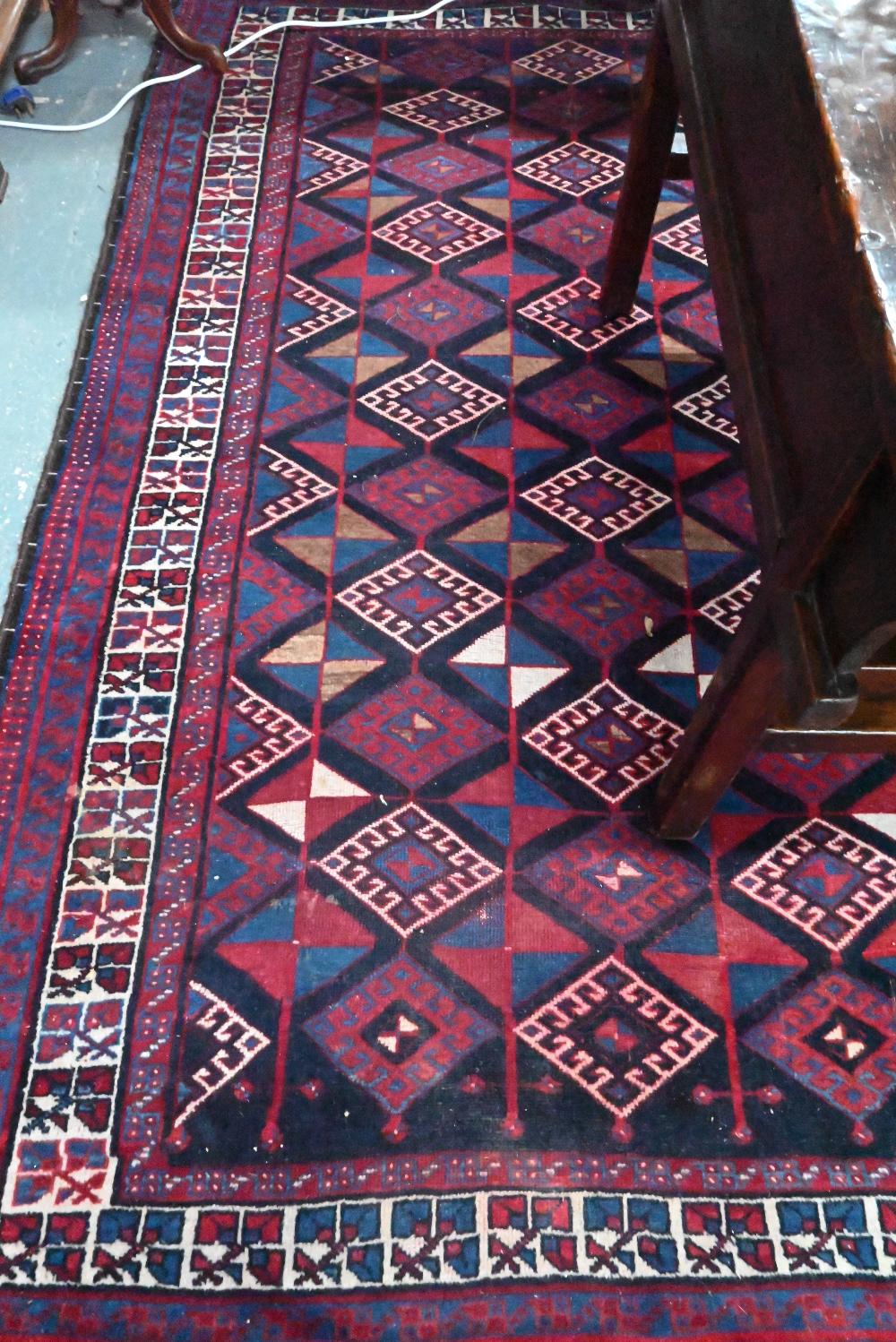 A Persian blue/red ground geometric design rug, 258 cm x 166 cm - Image 3 of 4