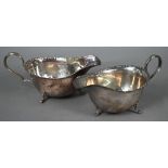 Pair of silver sauce boats in the Georgian manner, with shaped and reeded rims and scroll handles