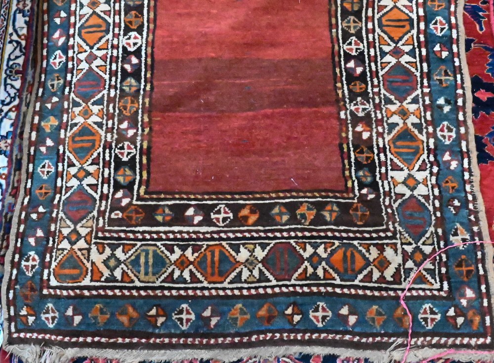 An antique Persian Hamadan rust-red ground runner, the stylised boteh within multi-coloured borders, - Image 2 of 3