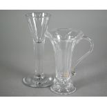 A Georgian fluted jelly glass with flared rim and scroll handle, on ogee goot, 11.5 cm to/w a