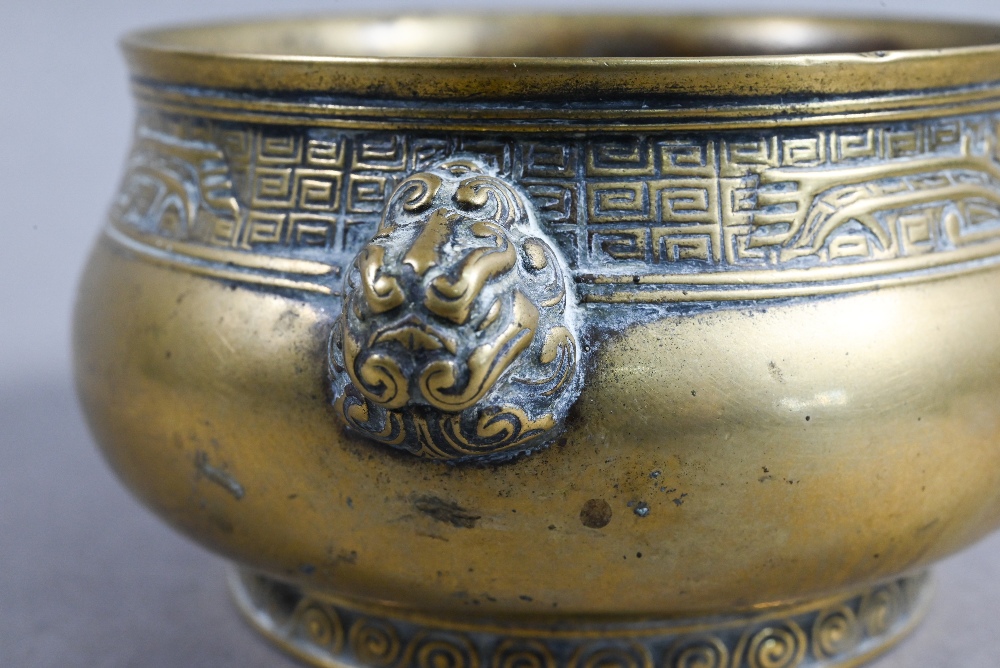 A 19th century Chinese bronze censer or incense burner of compressed globular form with cast - Image 4 of 8