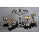 Silver two-handled trophy cup on plinth mounted with plaques, to/w two small tennis trophies another