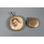 A circular yellow metal cased pendant containing portrait study of an infant, with seed pearl