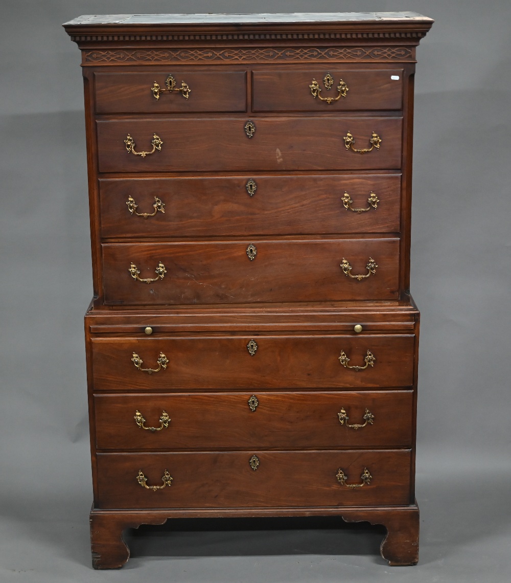 A George III mahogany chest on chest, the dentil moulded cornice over a blind fret frieze, two short