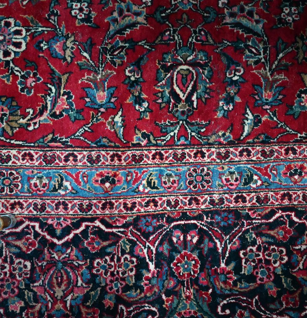 A fine old Persian hand-made Kashan carpet, the red ground with repeating linked garden vine design, - Image 8 of 12