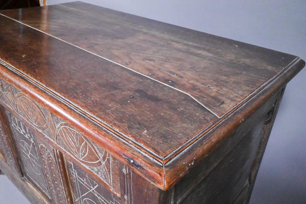 An early 18th and later oak coffer, with lunette carved frieze over a trio of incised panels, on - Image 8 of 8