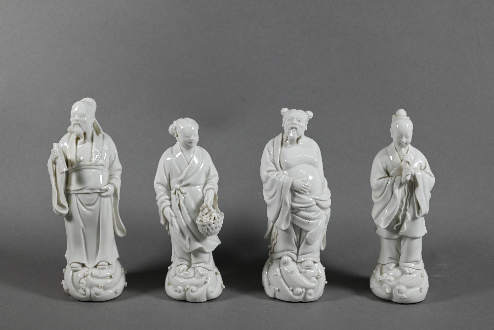 Four late 19th or early 20th century Chinese blanc-de-chine dehua porcelain figures of Daoist