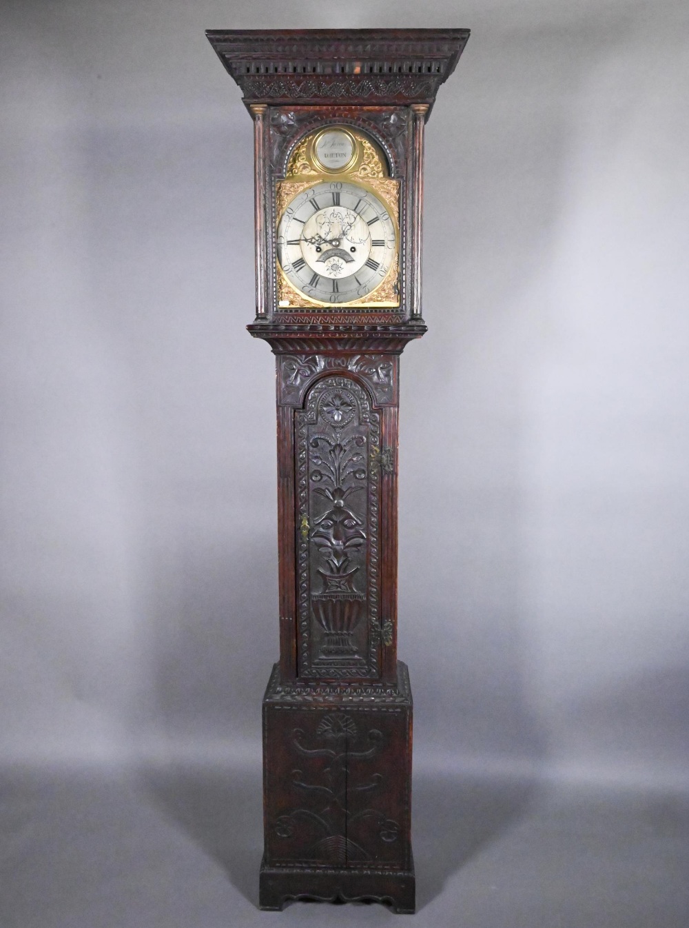 Jarvis, Dalton, an 18th century and later carved oak clock, the eight day movement with arched brass