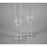 Georgian wine glass, the tapering bowl with concave and thumbnail cutting on facetted 'honeycomb'