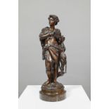Emile Boyer (1877 - 1948), a brown-patinated bronze sculpture of a huntsman in wolf-skin cloak,