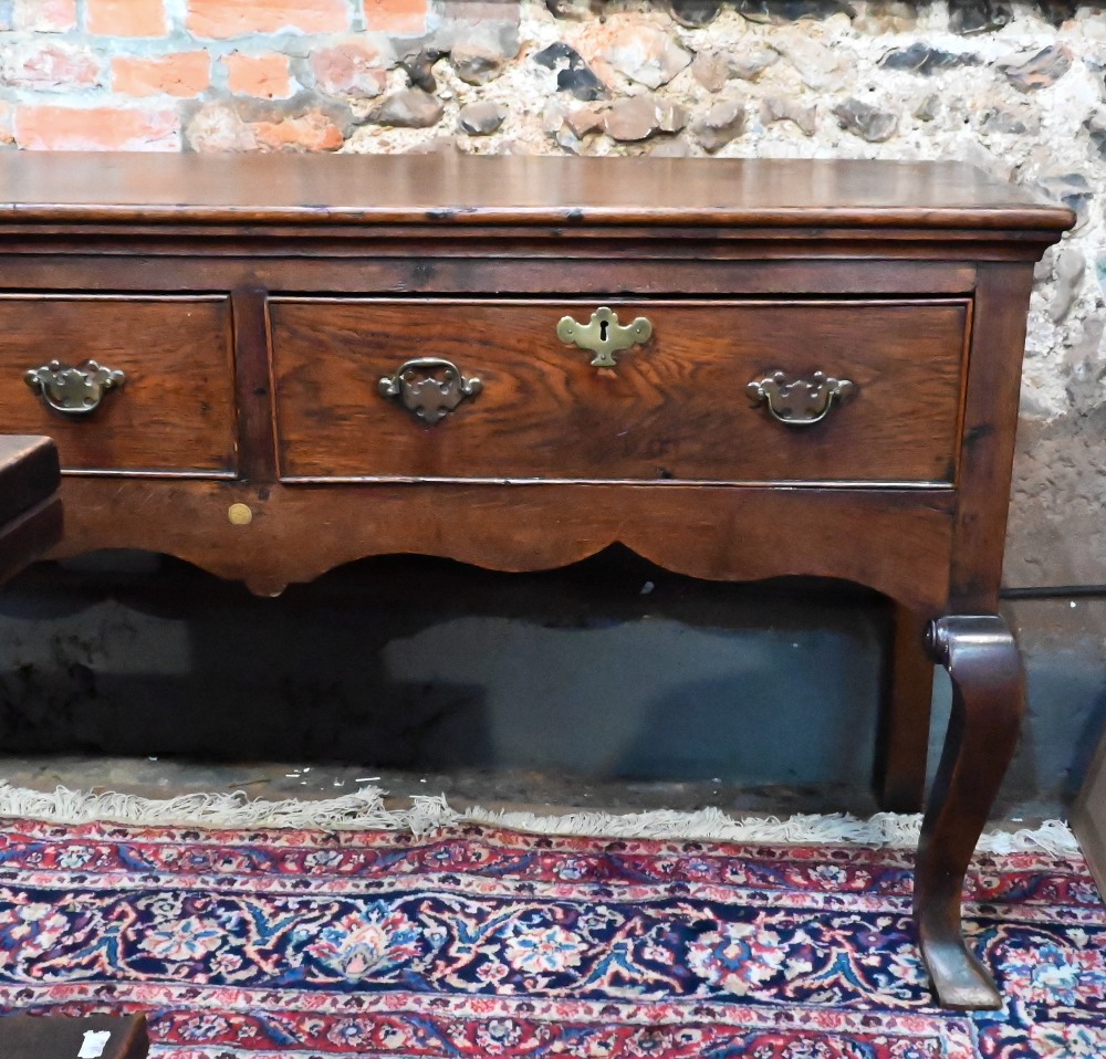 An 18th century cross-banded oak low dresser, with three cock-beaded frieze drawers over a wavy - Image 2 of 5