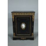 Druce & Co., London, a Victorian gilt-metal mounted ebonised pier cabinet, the door centred with