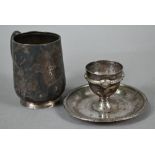 Silver egg cup with integral saucer, Atkin Bros, Birmingham 1927, to/w a Christening mug,