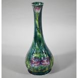 Art Nouveau George Cartlidge Morris Ware slender vase with bulbous base, decorated with flowers,