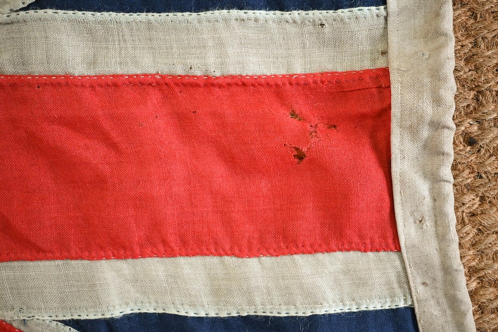 A WWII period Royal Navy ensign, of stitched panels with 'union jack' to top corner, stencilled 'C - Image 4 of 5