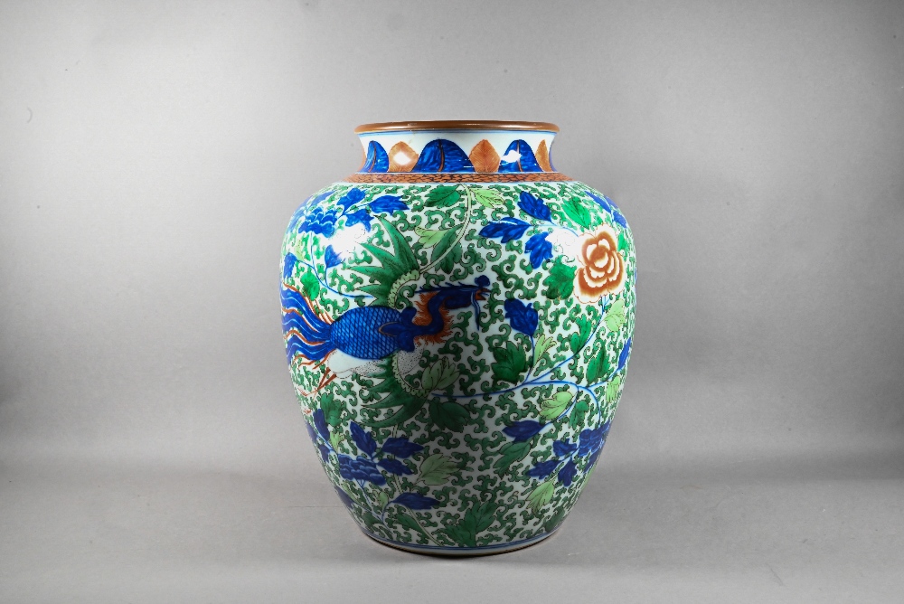 A large Chinese wucai vase, late Qing, painted in underglaze blue, copper red and polychrome enamels